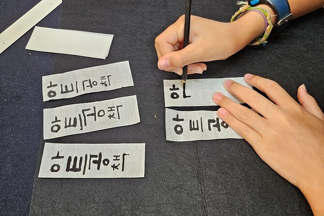 Create a Handmade Traditional Korean Notebook in Insadong - Personalizing the cover: Korean name calligraphy practice with a brush
