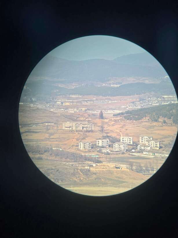 From Seoul: Aegibong Starbucks Observatory & DMZ View - Exhibition Hall windows, video stories, and the Jogang River orientation