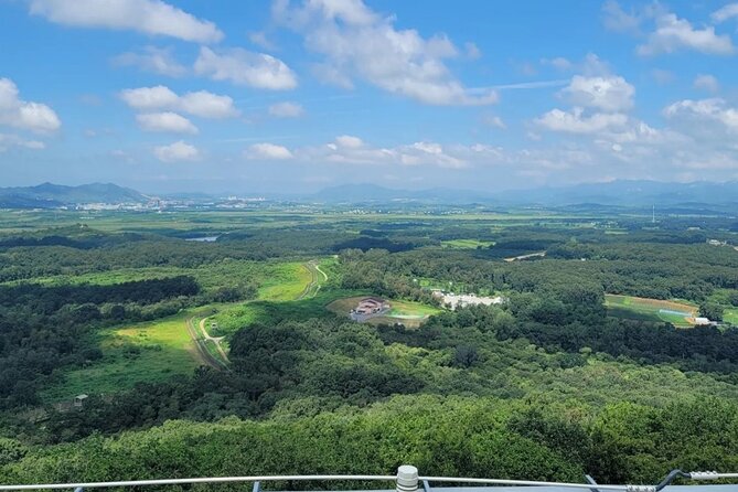 Small Group Tour to DMZ & Suspension Bridge with Hotel Pickup - Crossing into the DMZ: the blue line moment